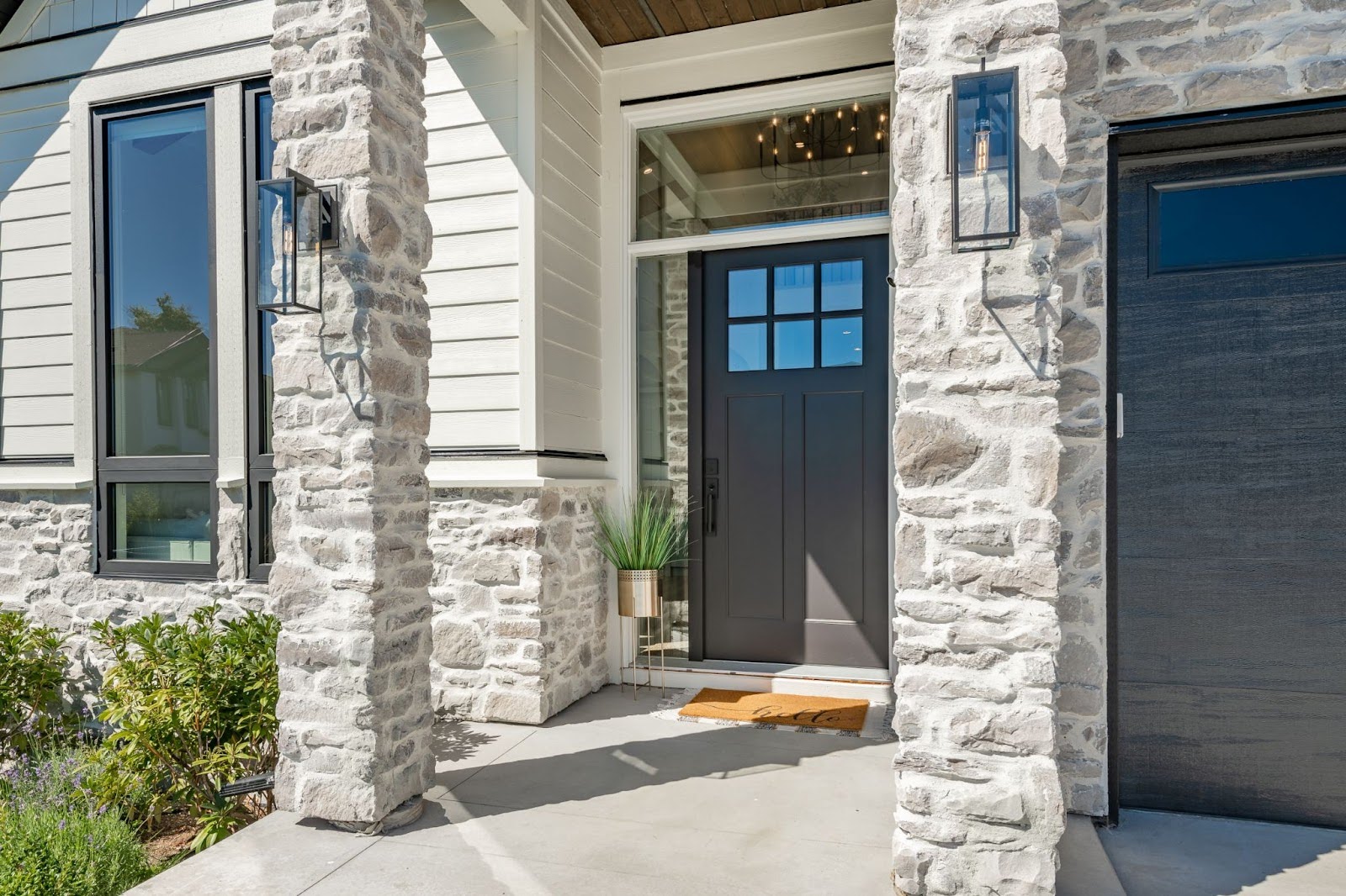 A picturesque suburban home exterior in the Philadelphia-Allentown area featuring a newly installed elegant front door with visible modern flooring and high-quality windows.